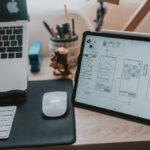 macbook pro beside apple magic mouse