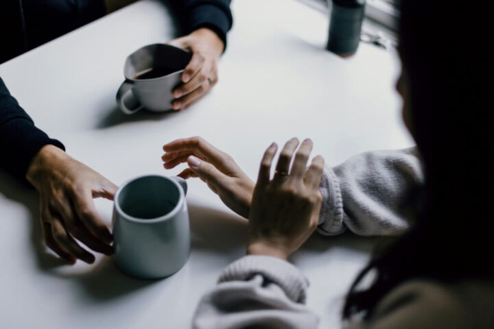 Group of people collaborating around a table, symbolizing artificial intelligence chat and collaboration