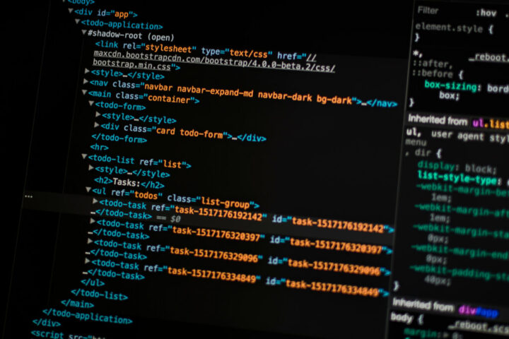 turned on monitor displaying programming language