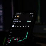 Cell phone displaying a stock chart indicating Ethereum cryptocurrency trends