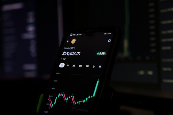 Cell phone displaying a stock chart indicating Ethereum cryptocurrency trends