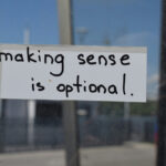 a sign that says making sense is optional