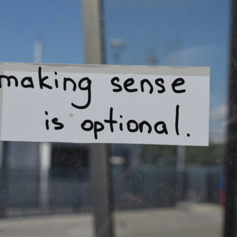 a sign that says making sense is optional