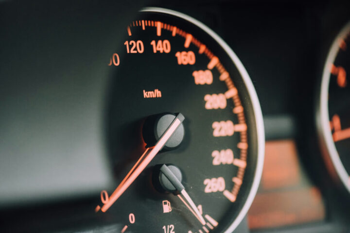 Closeup photo of black analog speedometer in a Dodge car 2025